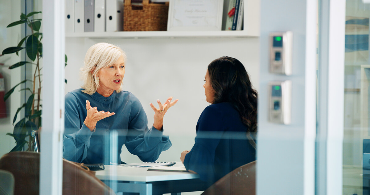 Two women sitting in an office