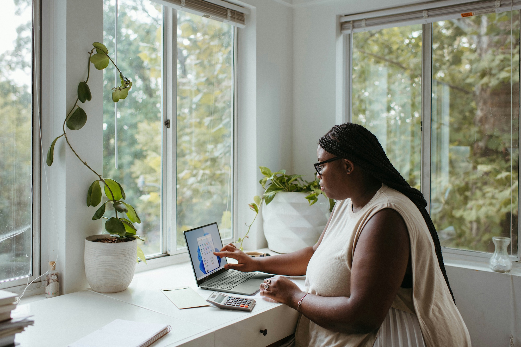 Young Woman Using Computer in Home Office